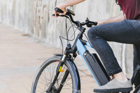 A photo of a person riding an e-bike