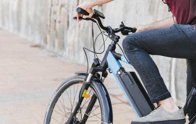 A photo of a person riding an e-bike