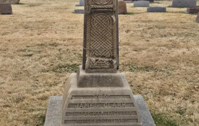 Broken sandstone Celtic cross headstone above the grave of James Clark's son.