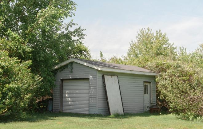 A Tool Shed In a Yard
