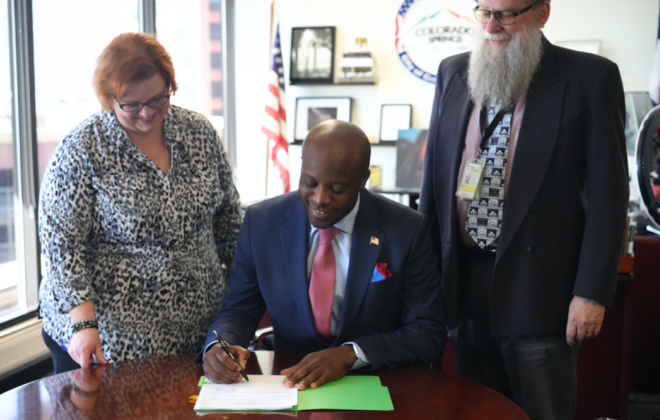 Mayor Remi certifies the results of the June 17, 2025 Municipal Election. City Clerk Sarah B. Johnson stands to his right and Lee McRae stands to his left.