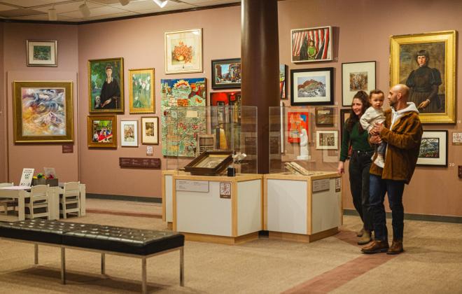 A family explores the new "50% of the Story: Women Expressing Creativity" exhibit at the Colorado Springs Pioneers Museum